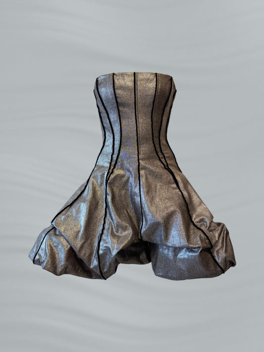 Silver metallic dress on a gray background