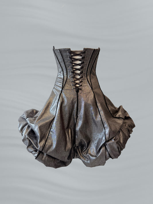 Metallic silver corset-style garment on a gray background